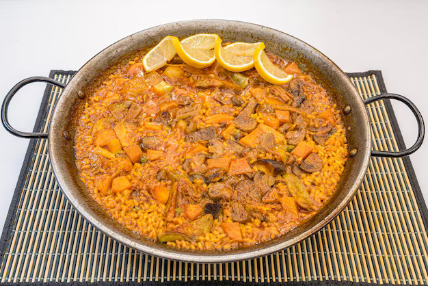 Final decoration of a paella before serving
